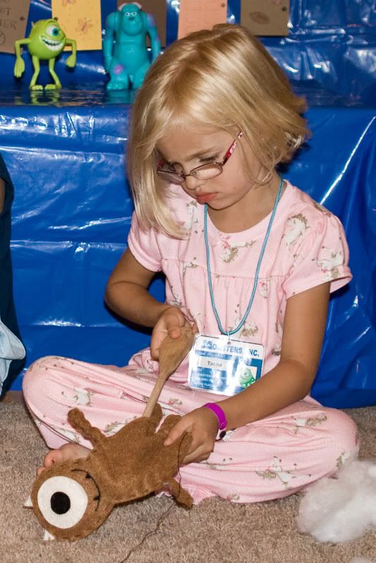 boo monsters inc holding teddy bear